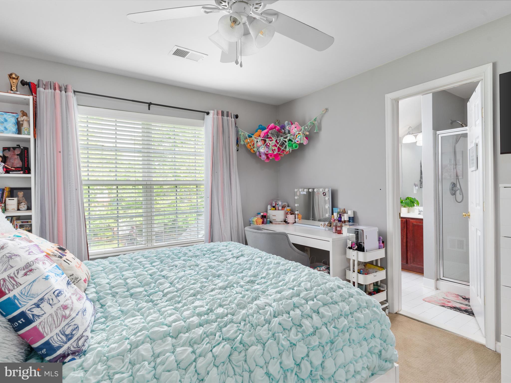 8705 Lords View Loop Gainesville, VA 20155 - Photo 28 of 58 a bedroom with a bed and a large window