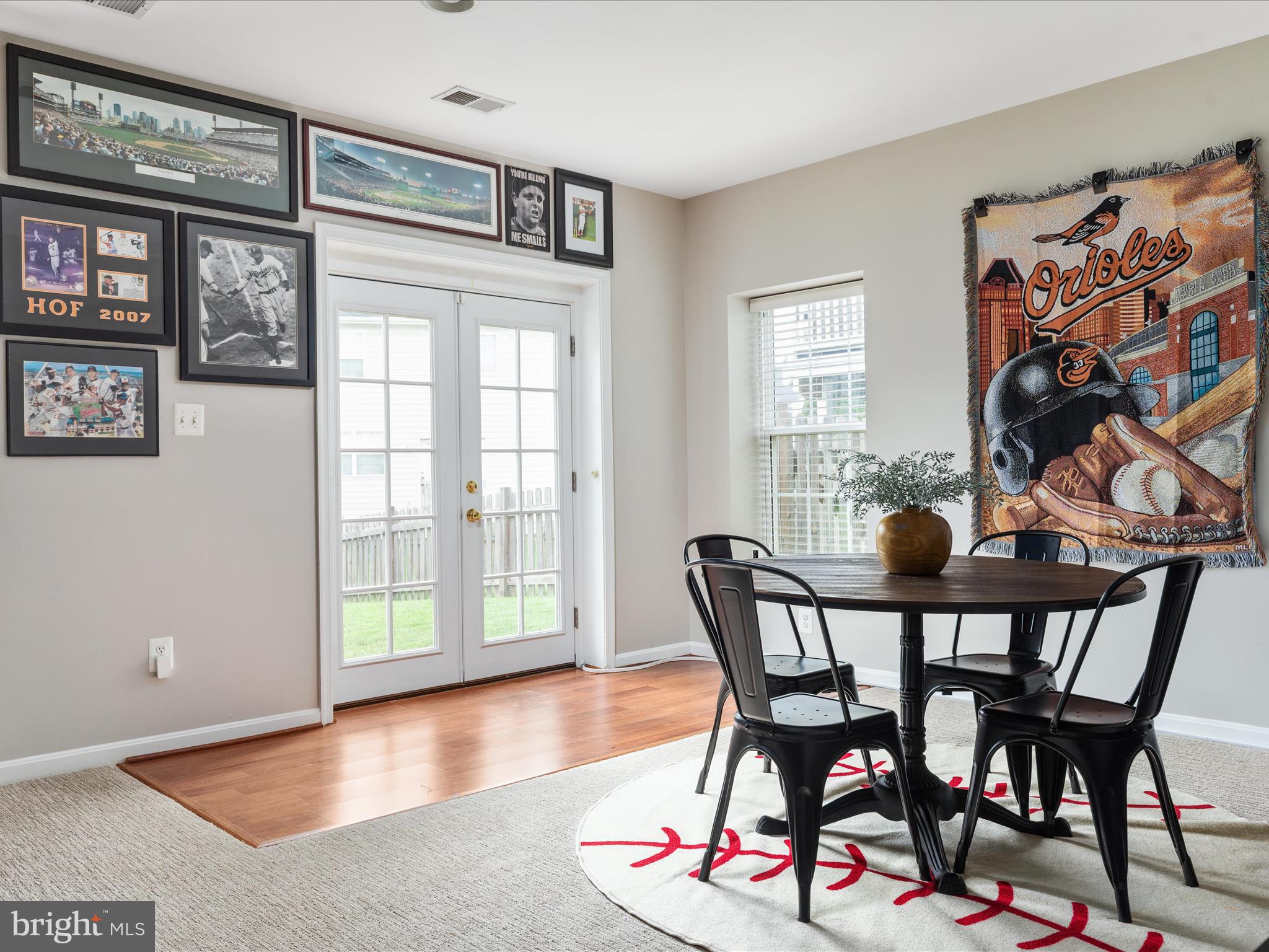 8705 Lords View Loop Gainesville, VA 20155 - Photo 32 of 58 a view of a dining room with furniture and wooden floor