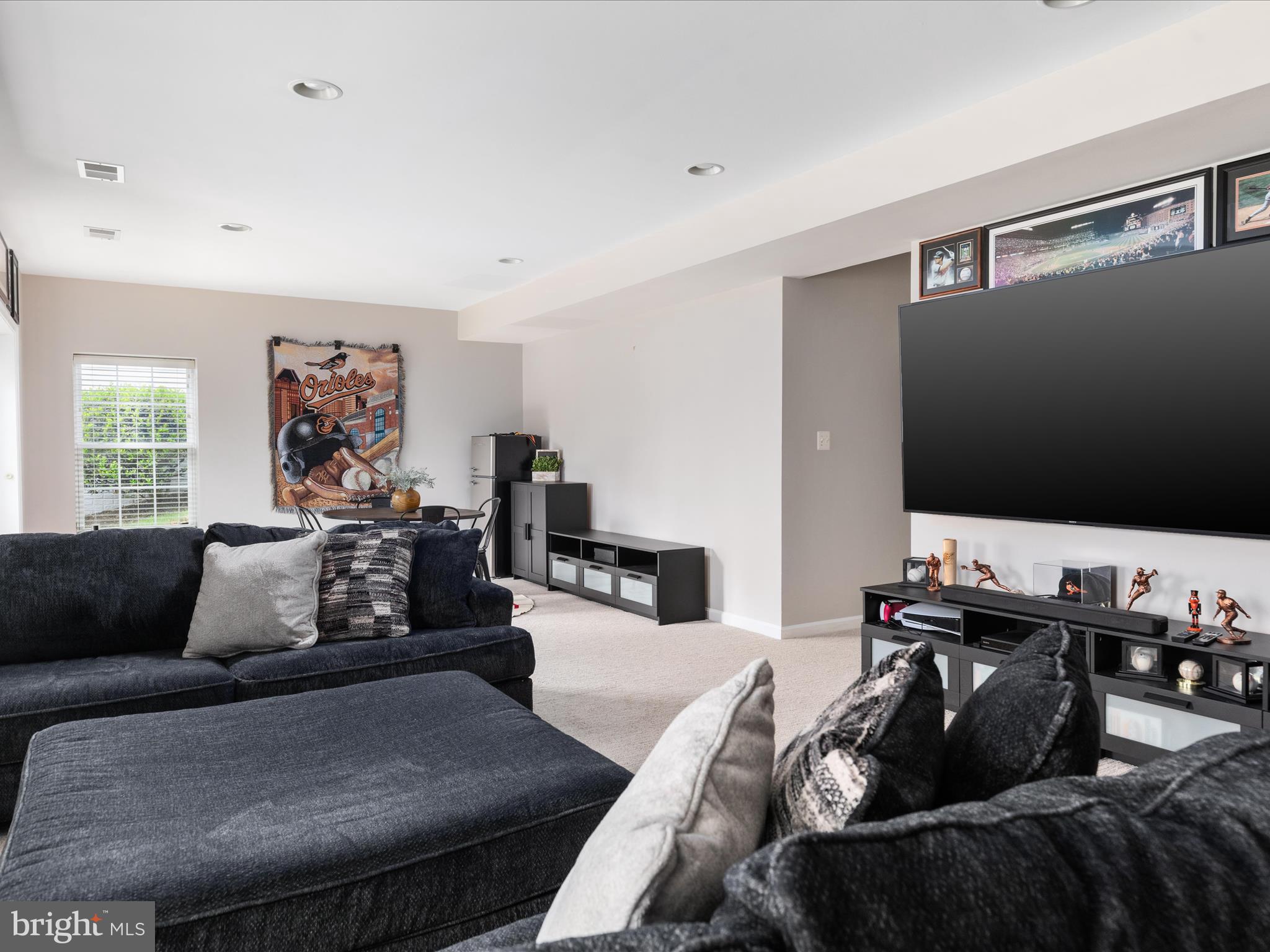 8705 Lords View Loop Gainesville, VA 20155 - Photo 33 of 58 a living room with furniture and a flat screen tv