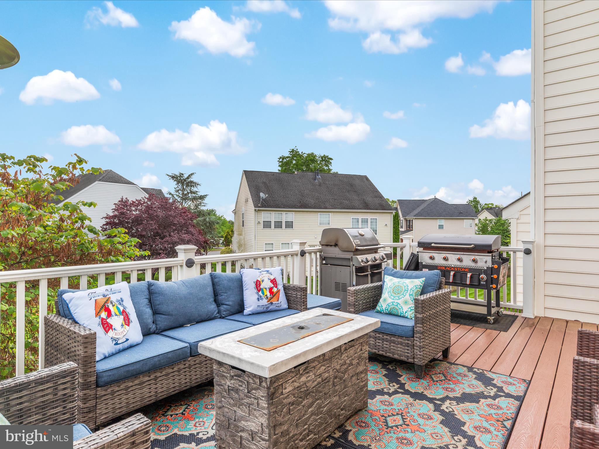 8705 Lords View Loop Gainesville, VA 20155 - Photo 37 of 58 a roof deck with couches and potted plants