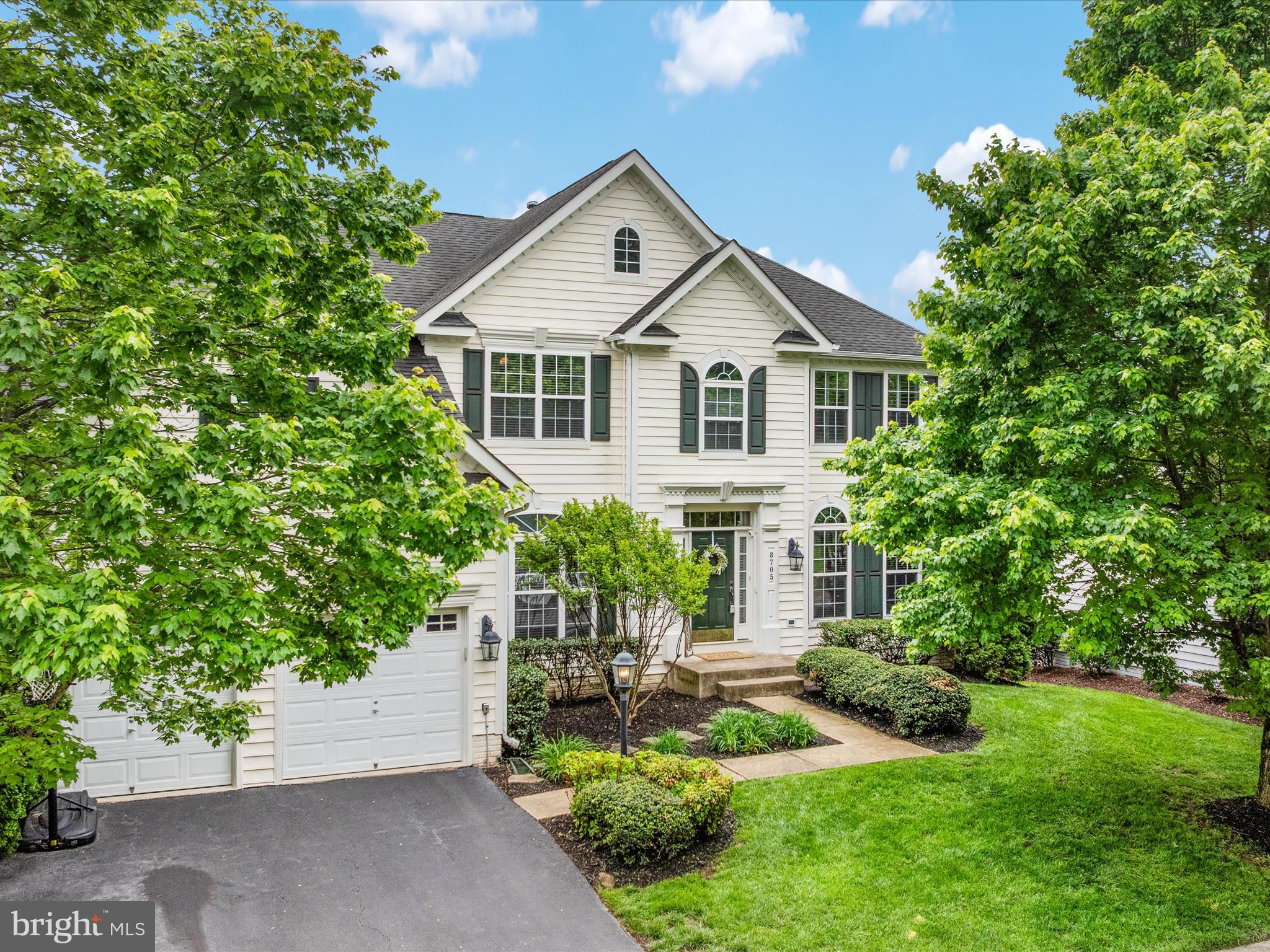 8705 Lords View Loop Gainesville, VA 20155 - Photo 41 of 58 a front view of a house with a yard