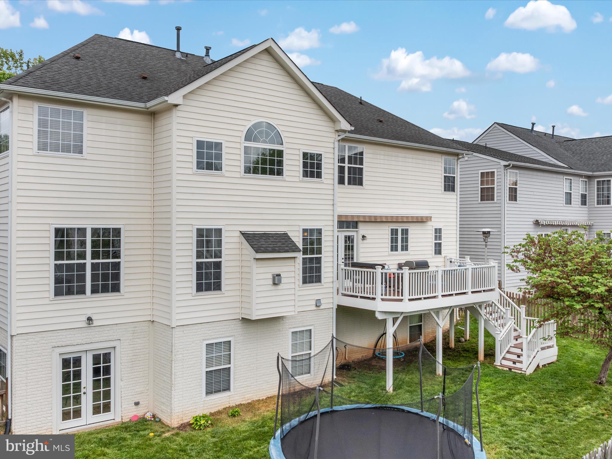 8705 Lords View Loop Gainesville, VA 20155 - Photo 42 of 58 a view of a house with a yard