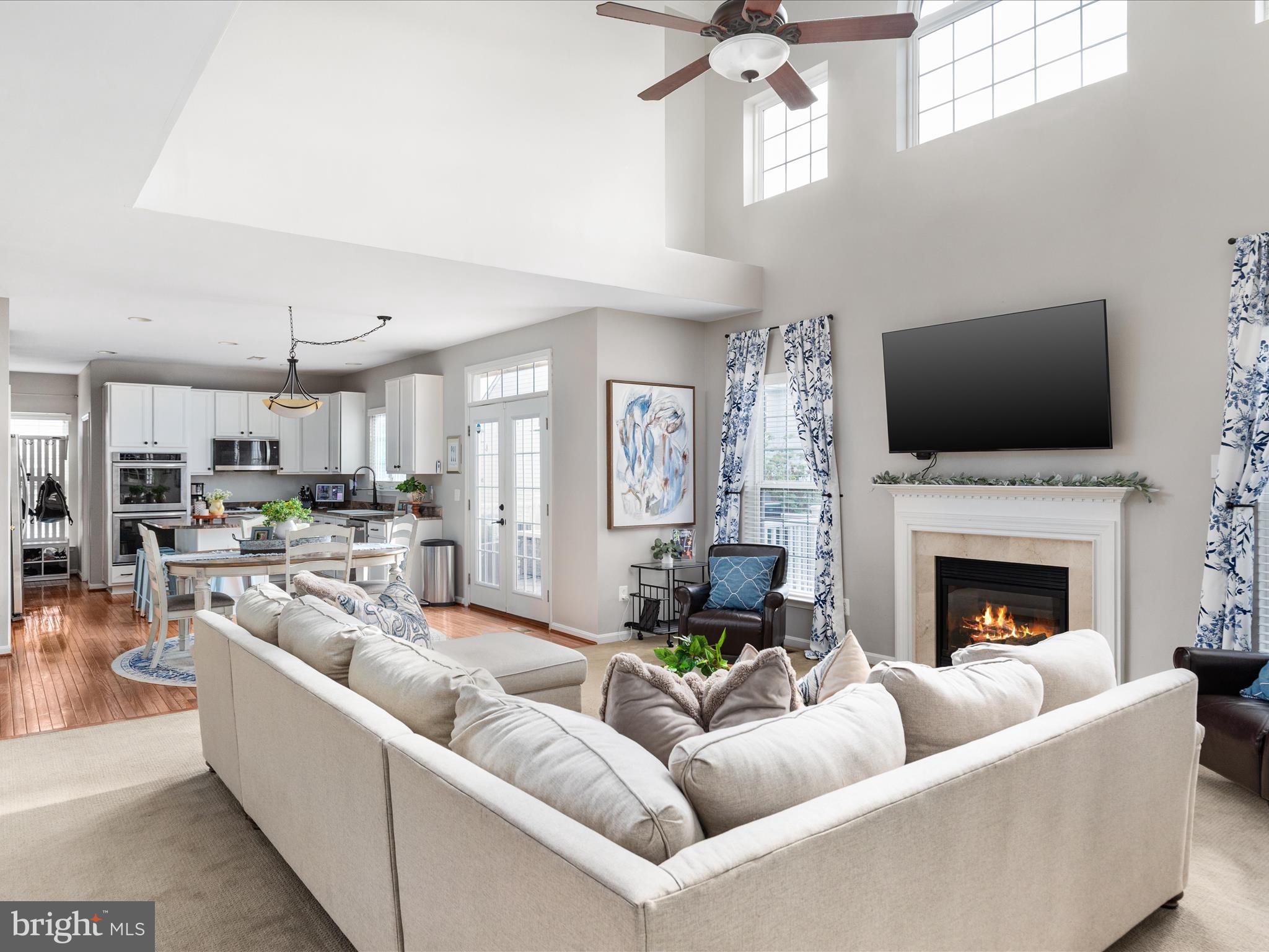 8705 Lords View Loop Gainesville, VA 20155 - Photo 6 of 58 a living room with furniture fireplace and a flat screen tv