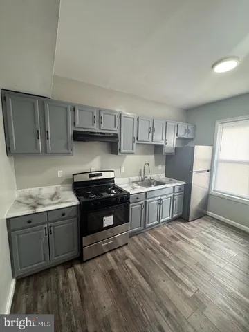 a kitchen with a stove and a sink