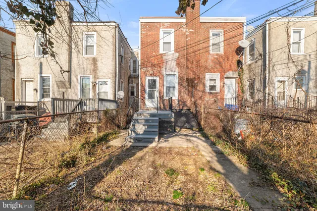 a view of balcony with wooden floor and fence