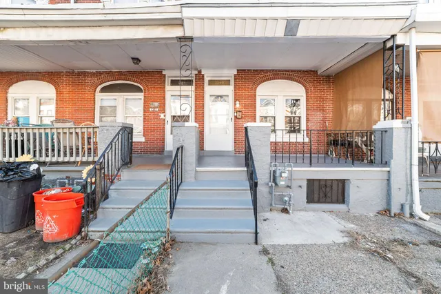 a view of living room kitchen with furniture and fireplace