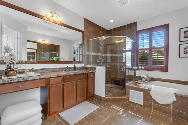 a bathroom with a sink double vanity and a mirror