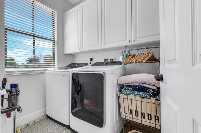 a kitchen with a stove a sink and a microwave