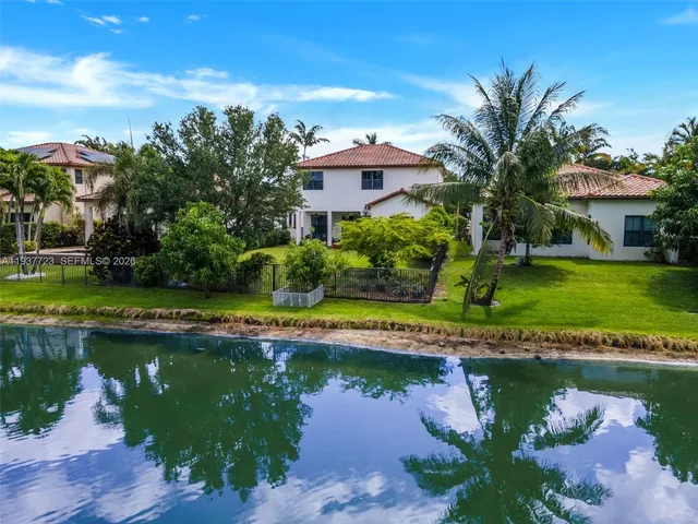 a view of a lake with a building in the background