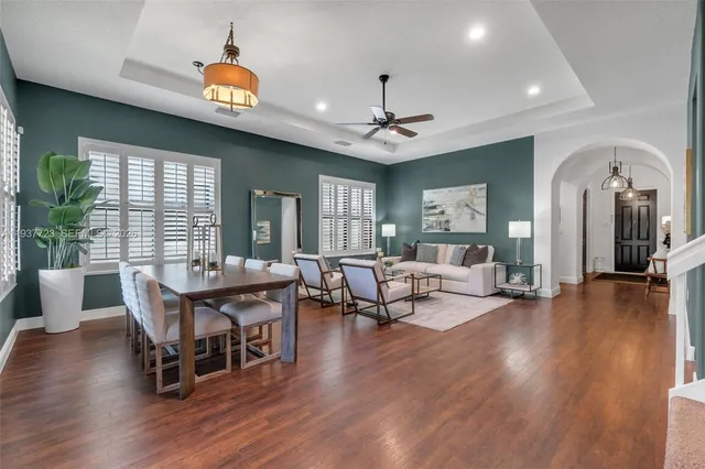 a view of a livingroom with furniture window and wooden floor