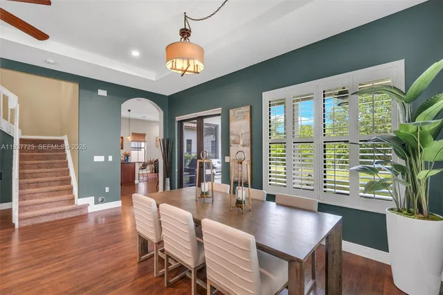 a view of a dining room with furniture window and wooden floor