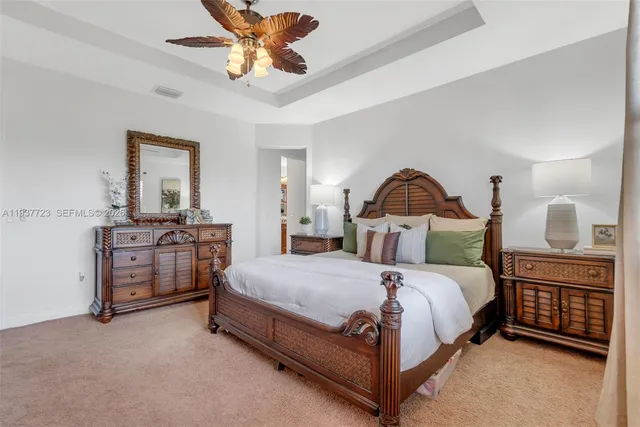 a bedroom with a bed and dresser