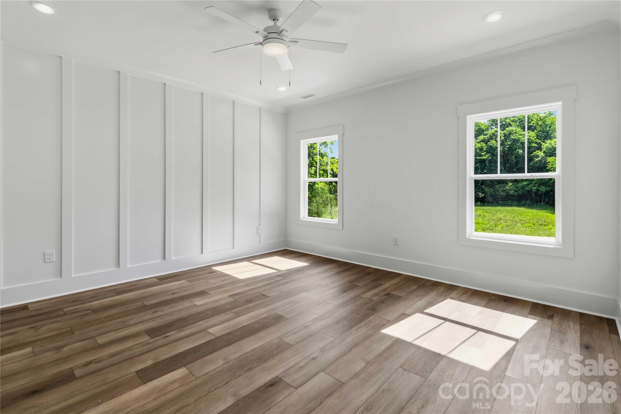 352 Adams Road Clover, SC 29710 - Photo 12 of 38 a view of an empty room with a window and wooden floor