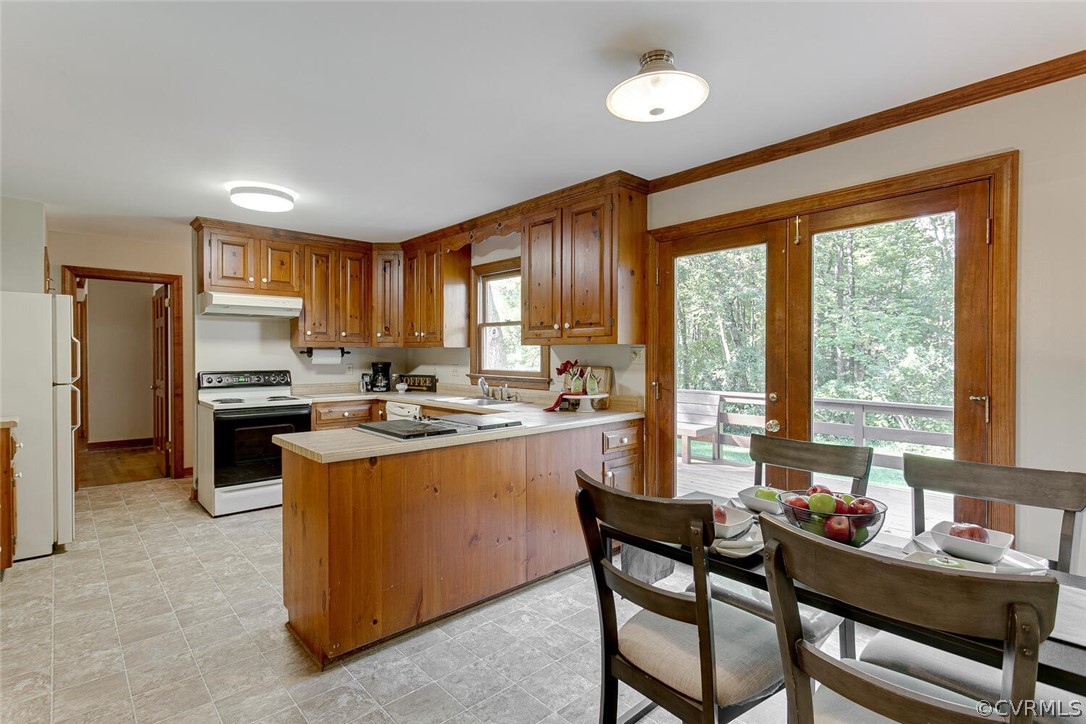 3414 Walkers Ferry Road Midlothian, VA 23112 - Photo 11 of 34 a kitchen with a table chairs microwave and cabinets