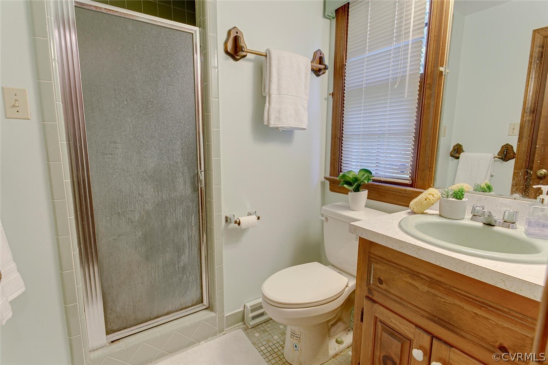 3414 Walkers Ferry Road Midlothian, VA 23112 - Photo 17 of 34 a bathroom with a sink a toilet and shower