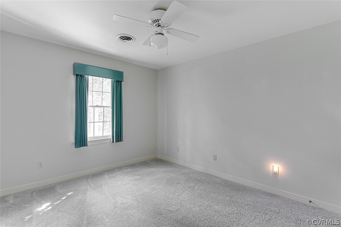 3414 Walkers Ferry Road Midlothian, VA 23112 - Photo 27 of 34 an empty room with a window and ceiling fan