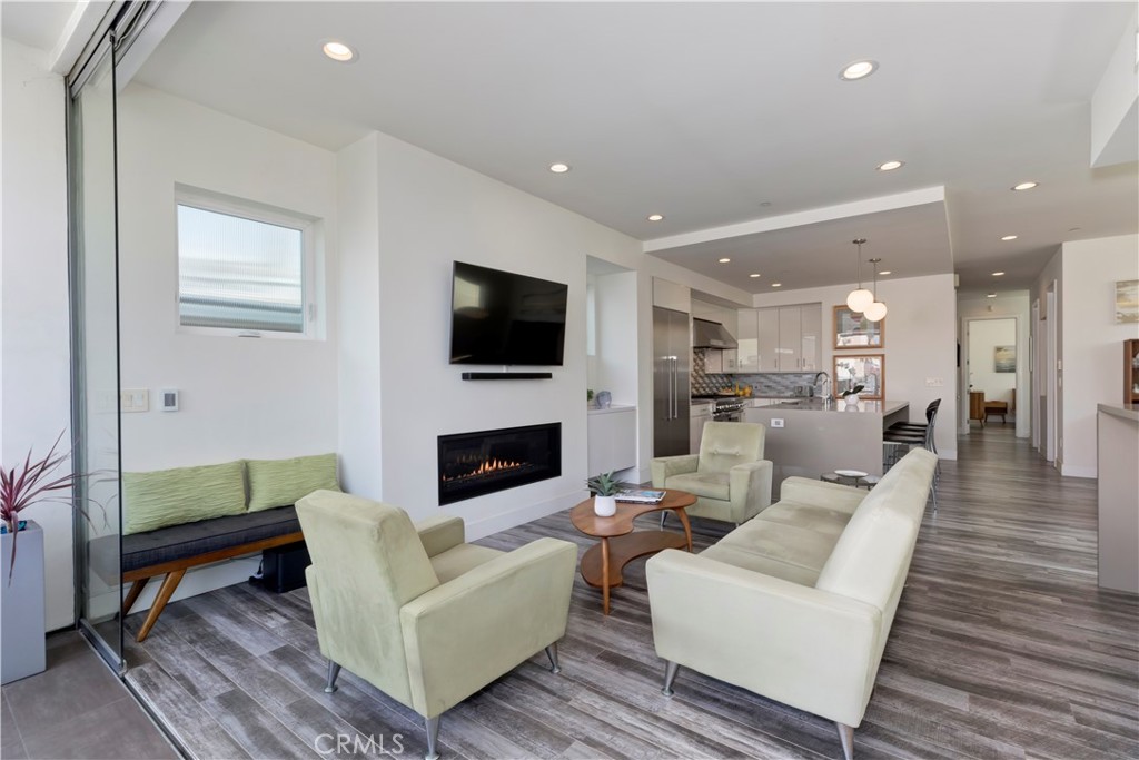 48 57th Place Long Beach, CA 90803 - Photo 11 of 47 a living room with furniture a fireplace and a flat screen tv
