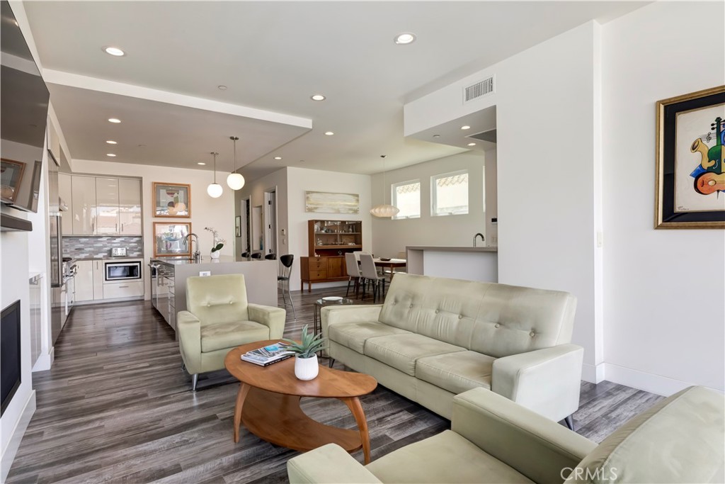 48 57th Place Long Beach, CA 90803 - Photo 12 of 47 a living room with furniture kitchen view and a wooden floor