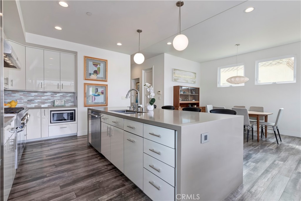 48 57th Place Long Beach, CA 90803 - Photo 13 of 47 a kitchen with white cabinets and white appliances