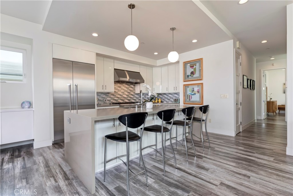 48 57th Place Long Beach, CA 90803 - Photo 16 of 47 a view of a dining room with furniture and wooden floor
