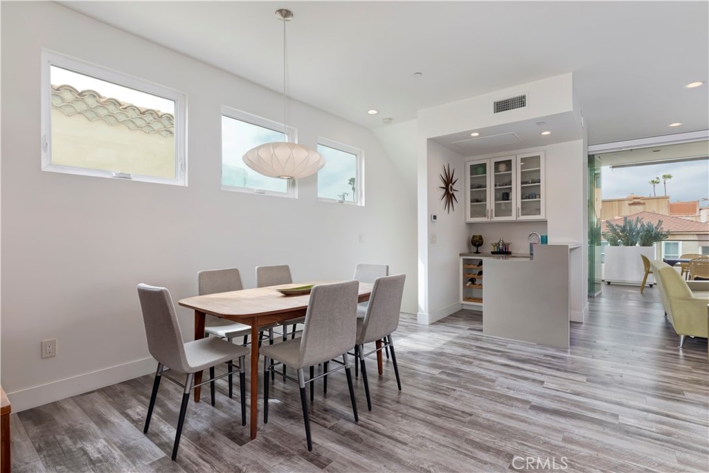48 57th Place Long Beach, CA 90803 - Photo 18 of 47 a view of a dining room with furniture and wooden floor