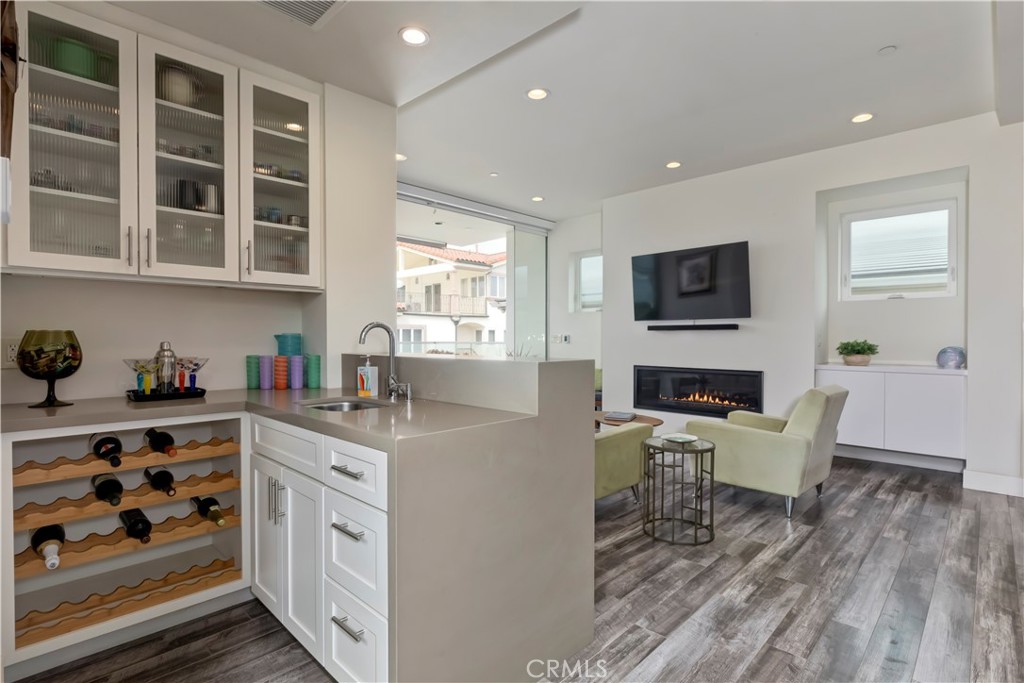 48 57th Place Long Beach, CA 90803 - Photo 19 of 47 a living room with furniture a fireplace and a flat screen tv
