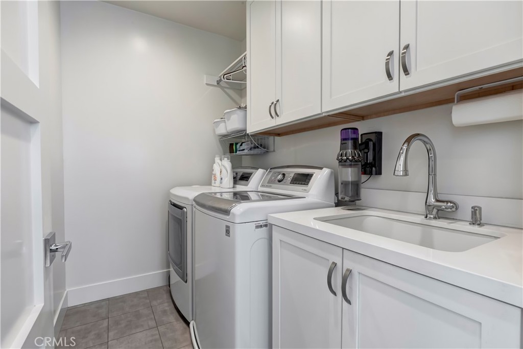48 57th Place Long Beach, CA 90803 - Photo 33 of 47 a utility room with sink dryer and washer
