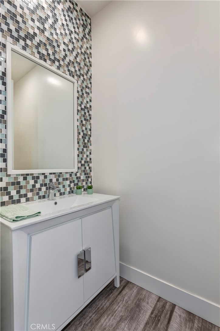 48 57th Place Long Beach, CA 90803 - Photo 36 of 47 a bathroom with a sink and a mirror