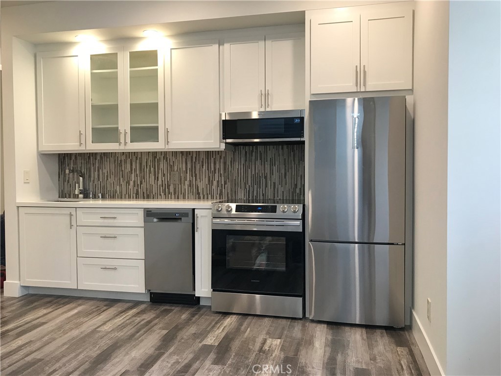 48 57th Place Long Beach, CA 90803 - Photo 43 of 47 a kitchen with appliances cabinets and a sink