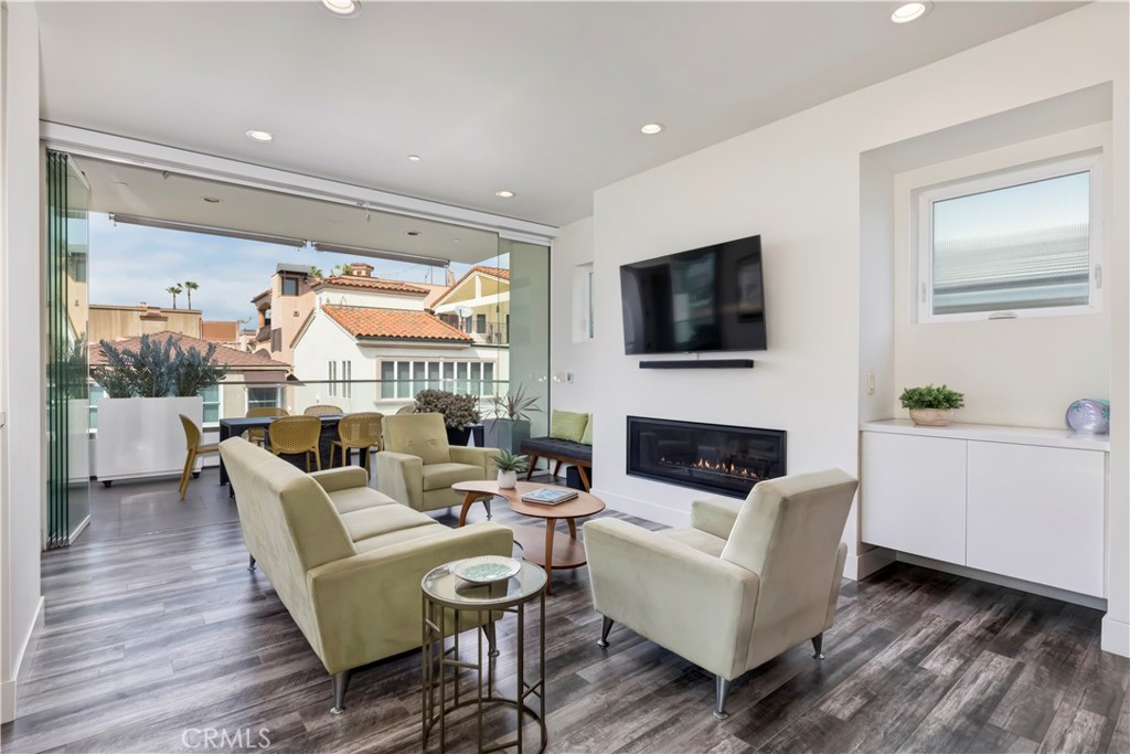 48 57th Place Long Beach, CA 90803 - Photo 8 of 47 a living room with fireplace furniture and a flat screen tv