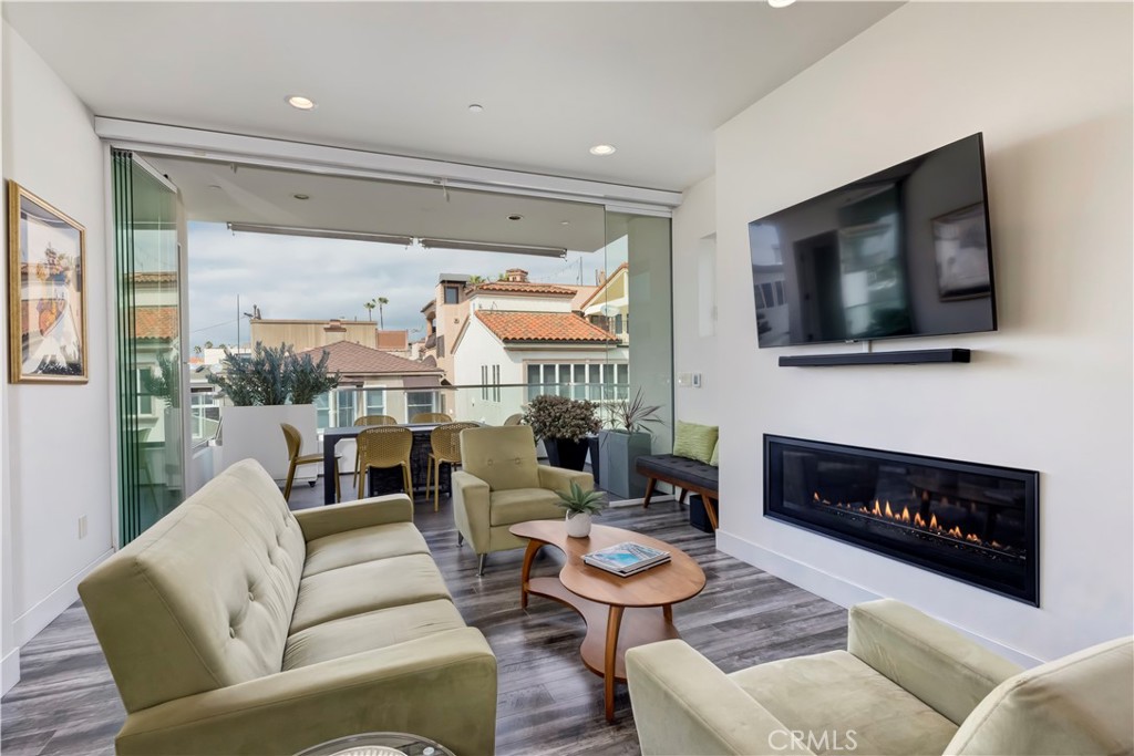 48 57th Place Long Beach, CA 90803 - Photo 9 of 47 a living room with furniture a fireplace and a flat screen tv