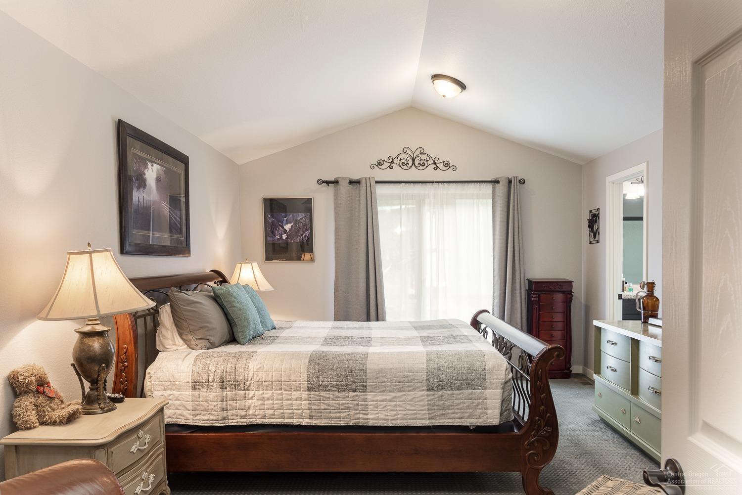 60281 Cheyenne Road Bend, OR 97702 - Photo 12 of 25 Master bedroom with vaulted ceiling, wa