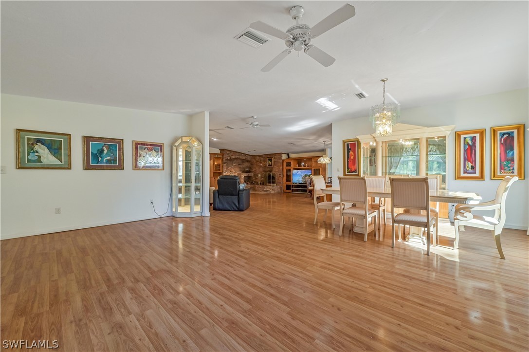 20100 Haskins Road North Fort Myers, FL 33917 - Photo 11 of 35 a view of a dining room with furniture window and wooden floor