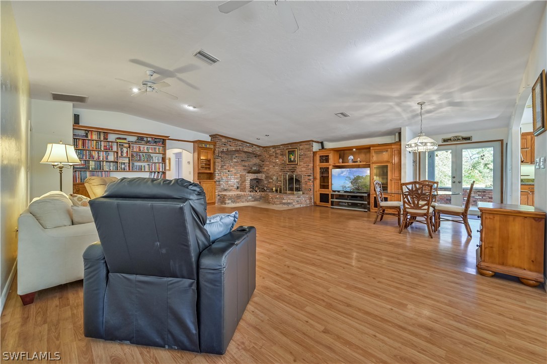 20100 Haskins Road North Fort Myers, FL 33917 - Photo 12 of 35 a living room with furniture and wooden floor