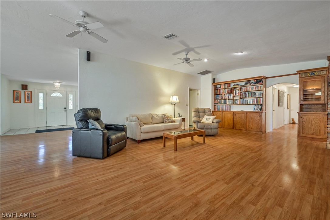 20100 Haskins Road North Fort Myers, FL 33917 - Photo 13 of 35 a living room with furniture and wooden floor