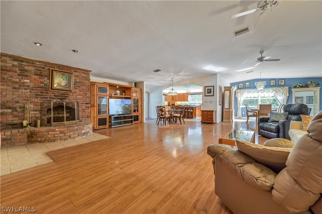 20100 Haskins Road North Fort Myers, FL 33917 - Photo 15 of 35 a living room with furniture and a flat screen tv