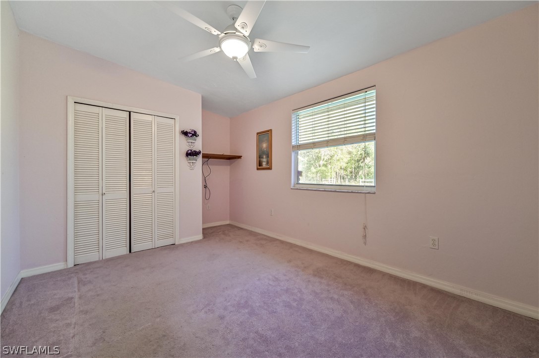 20100 Haskins Road North Fort Myers, FL 33917 - Photo 26 of 35 an empty room with a window and a fan