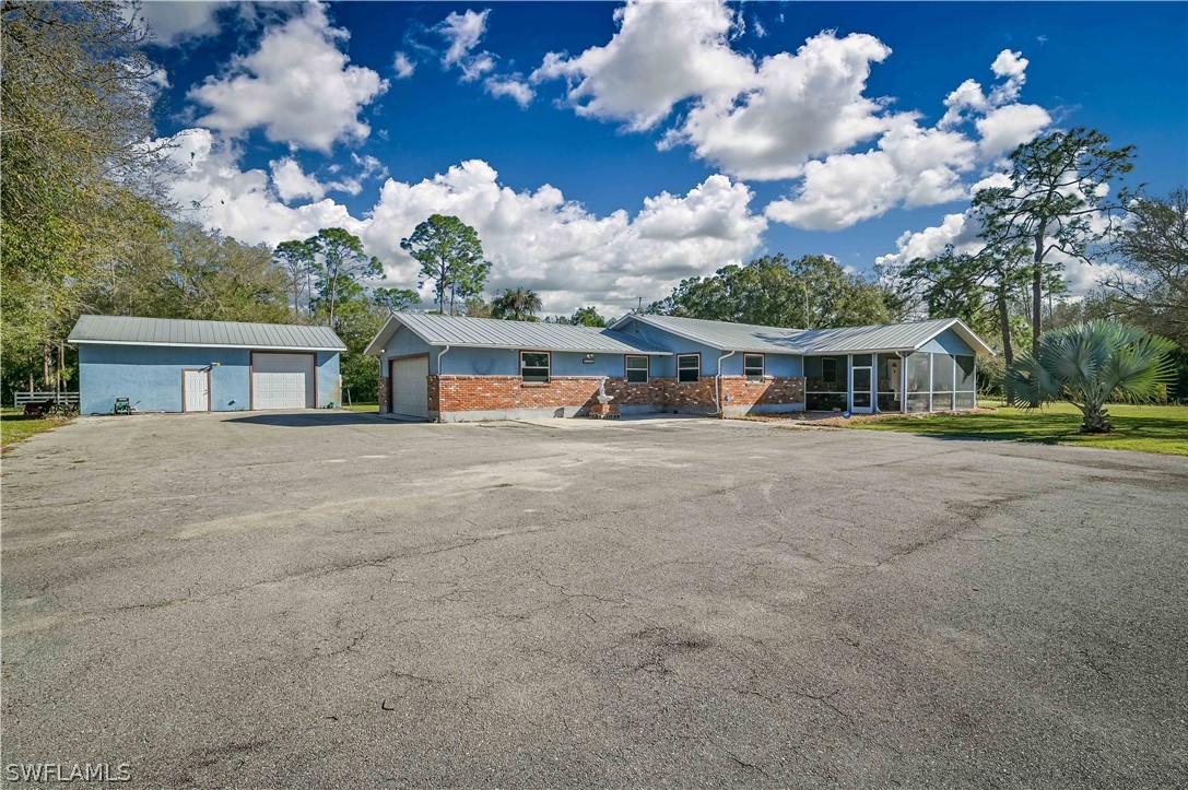20100 Haskins Road North Fort Myers, FL 33917 - Photo 3 of 35 a view of house with outdoor space and street view