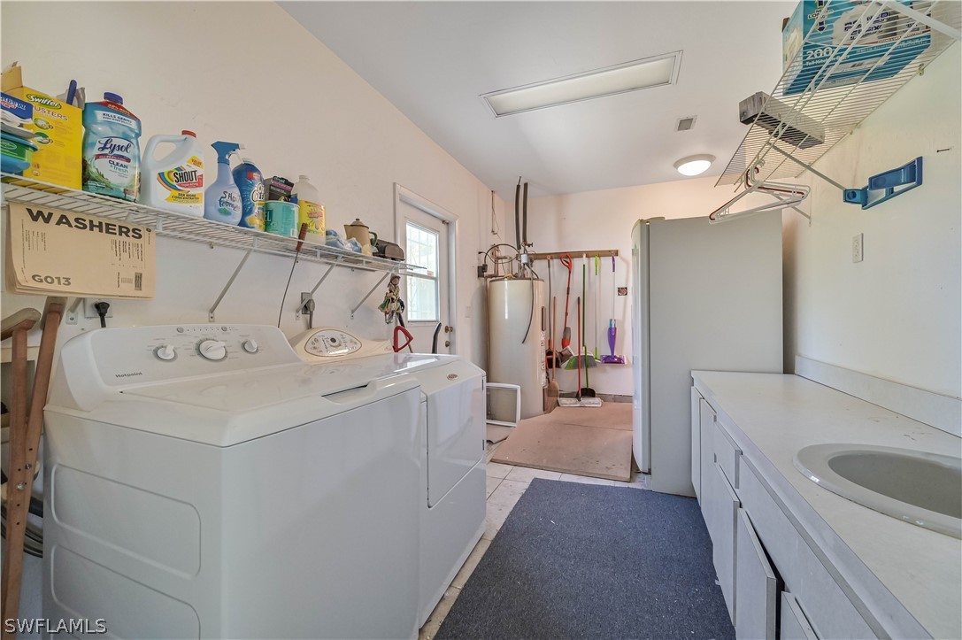 20100 Haskins Road North Fort Myers, FL 33917 - Photo 32 of 35 a utility room with dryer and washer