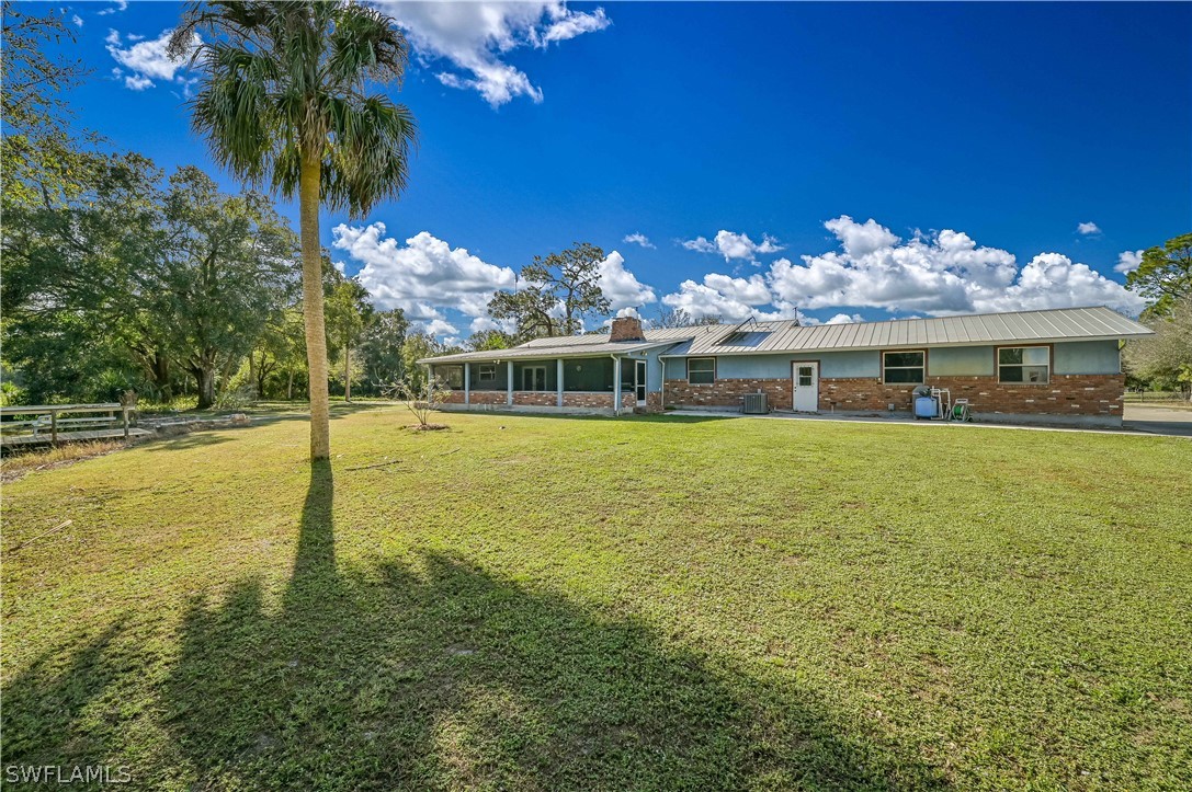 20100 Haskins Road North Fort Myers, FL 33917 - Photo 4 of 35 a view of a building with a swimming pool