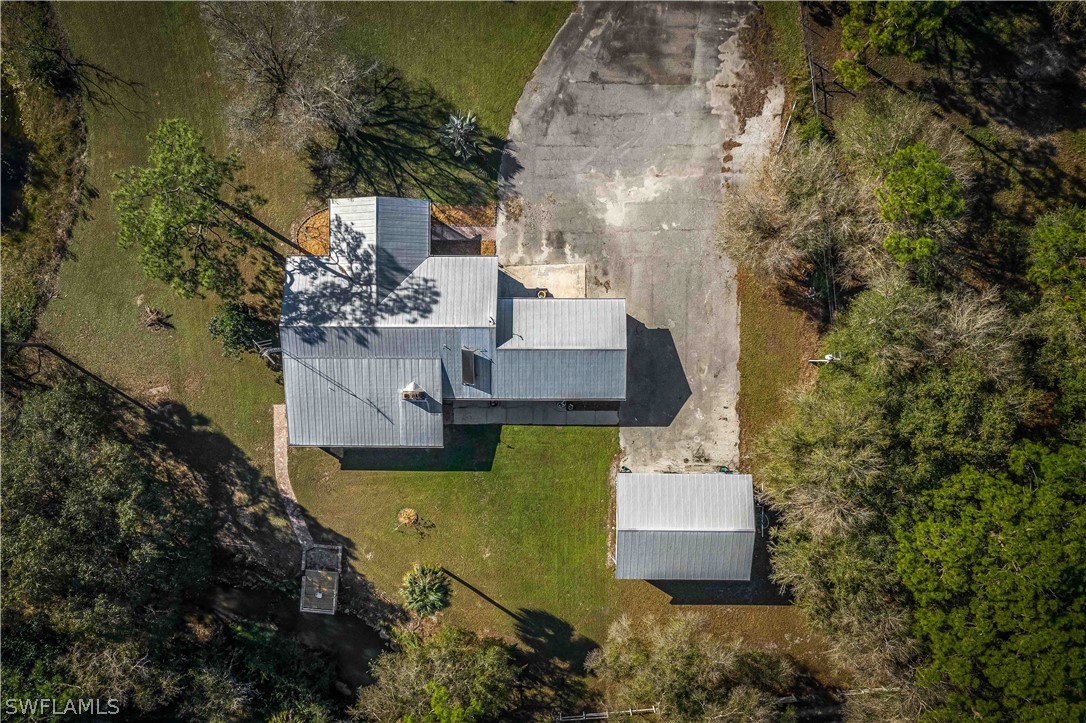 20100 Haskins Road North Fort Myers, FL 33917 - Photo 6 of 35 an aerial view of a house with outdoor space