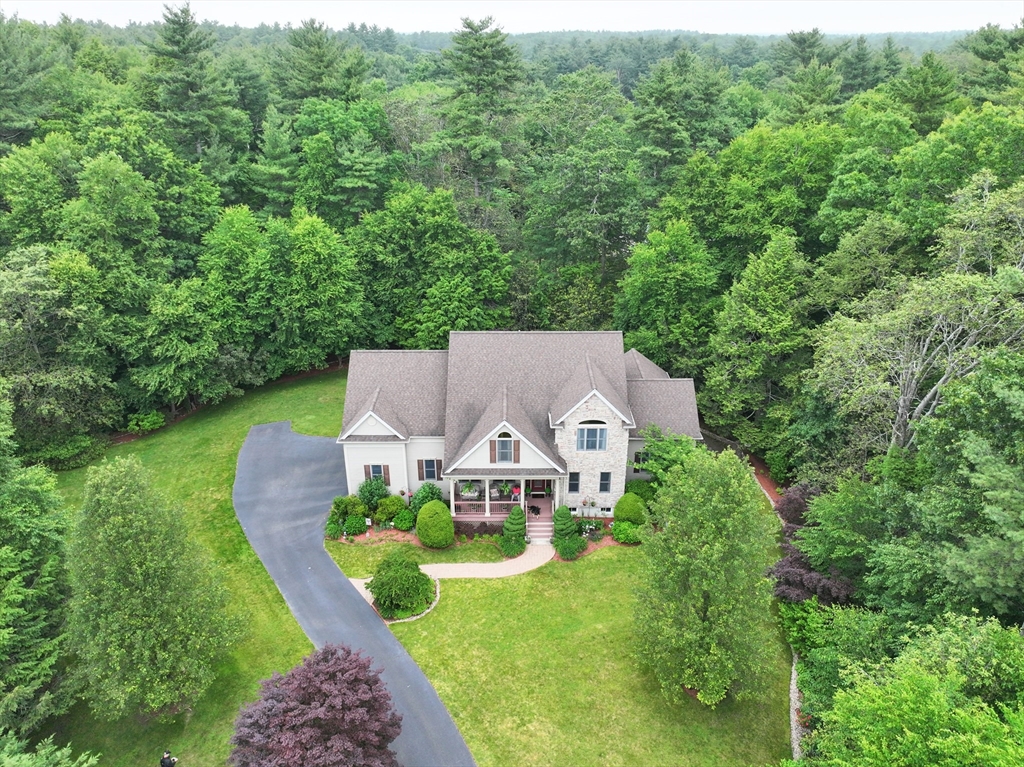 70 Azalea Way Hanson, MA 02341 - Photo 1 of 42 an aerial view of a house with swimming pool big yard and large trees