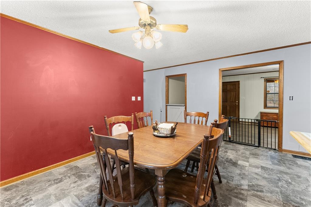 1527 Gold Mine Road Dawsonville, GA 30534 - Photo 11 of 39 a view of a dining room with furniture and a chandelier