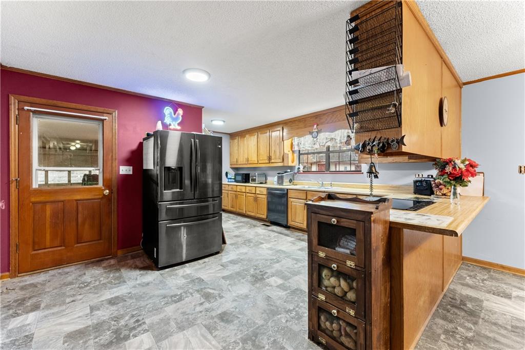 1527 Gold Mine Road Dawsonville, GA 30534 - Photo 12 of 39 a kitchen with stainless steel appliances granite countertop a refrigerator and a stove