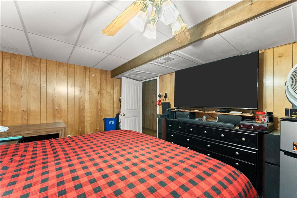 1527 Gold Mine Road Dawsonville, GA 30534 - Photo 18 of 39 a bedroom with a bed and a flat screen tv