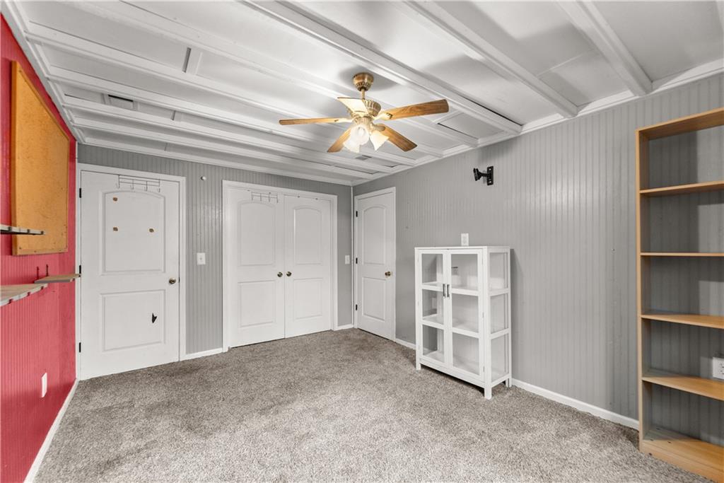 1527 Gold Mine Road Dawsonville, GA 30534 - Photo 26 of 39 a view of a livingroom with a bookshelf
