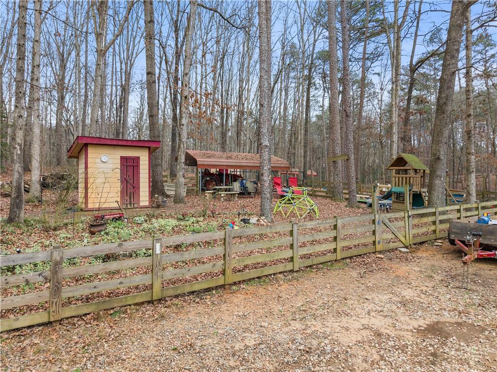1527 Gold Mine Road Dawsonville, GA 30534 - Photo 29 of 39 a view of a chairs setting on the deck