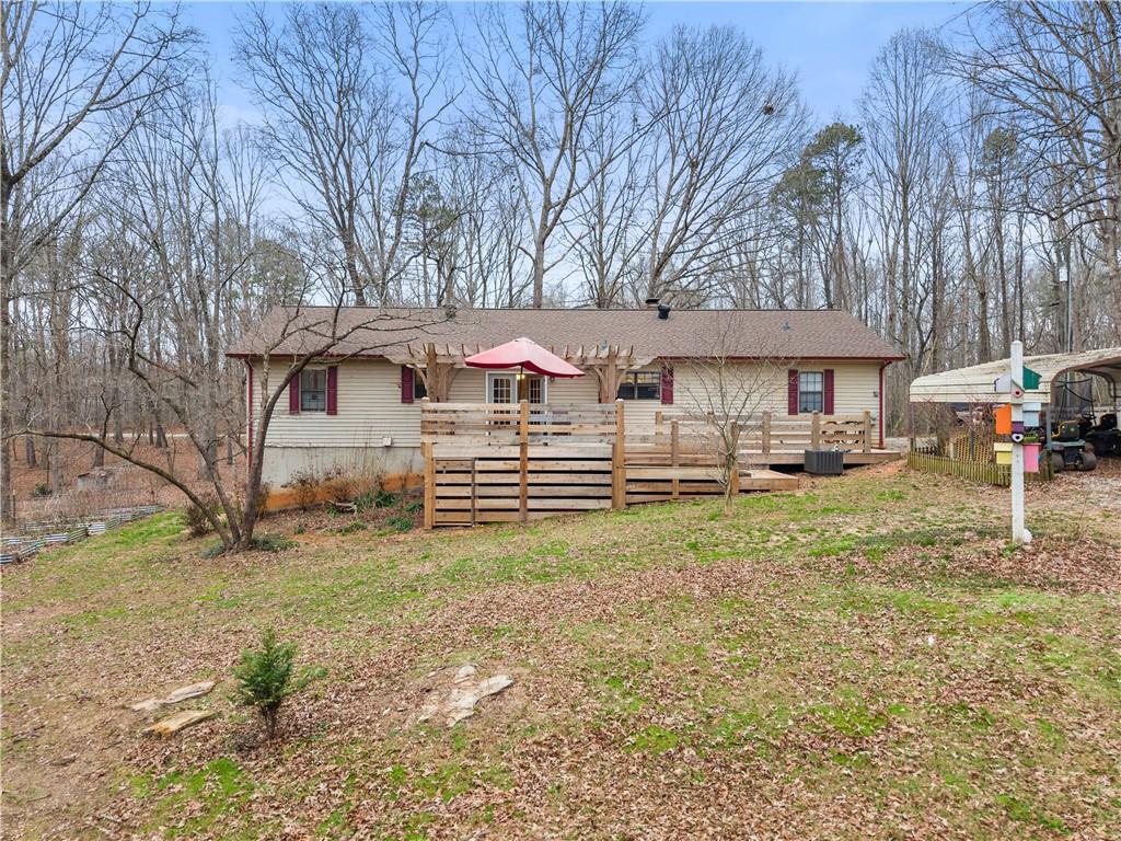 1527 Gold Mine Road Dawsonville, GA 30534 - Photo 34 of 39 a front view of a house with garden