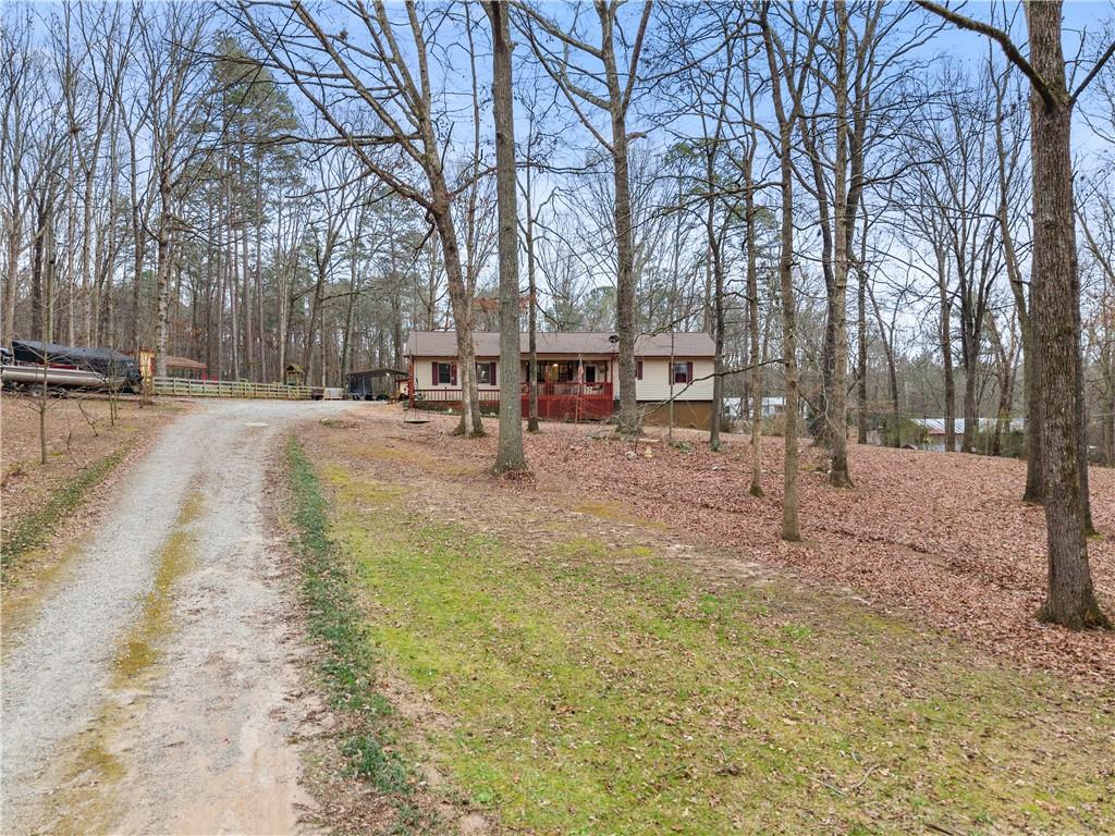 1527 Gold Mine Road Dawsonville, GA 30534 - Photo 5 of 39 a view of a yard with wooden fence