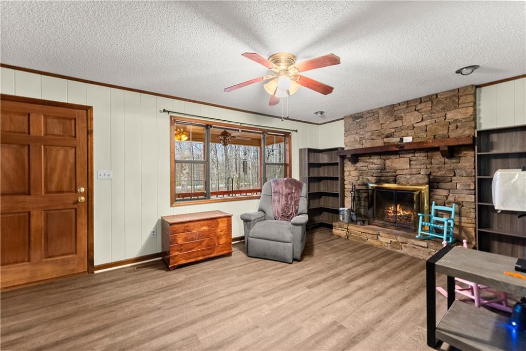 1527 Gold Mine Road Dawsonville, GA 30534 - Photo 7 of 39 a living room with furniture and a fireplace